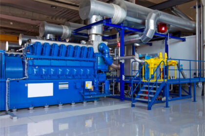 Heat recovery system at a biogas-fired water treatment plant, with industrial piping and heat exchanger.